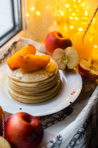 pancakes with fruit on a windowsill in winter