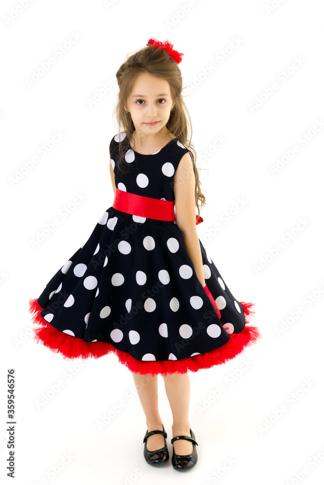 Full length portrait of a beautiful polka dot girl. Full length portrait of a beautiful polka dot girl.