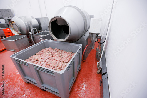 A frame image of a crates of raw spicy meat. Process for the production of products of animal origin. photo