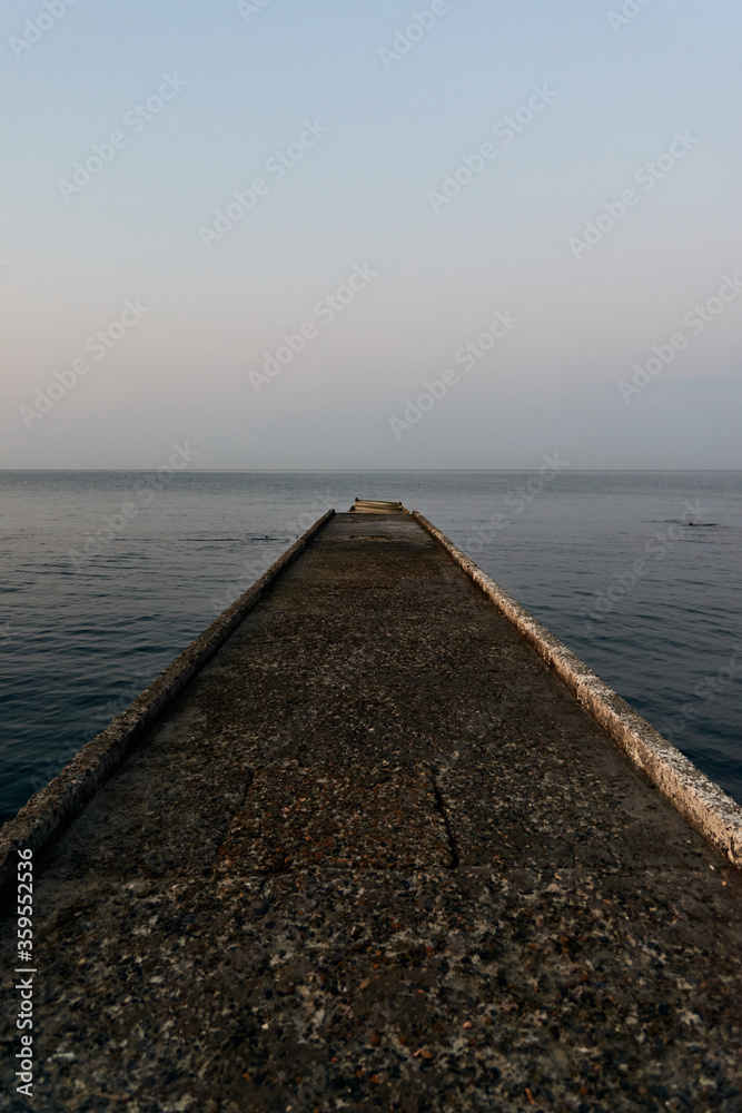 concrete sea berth for boats and yachts and sea water surface in the morning