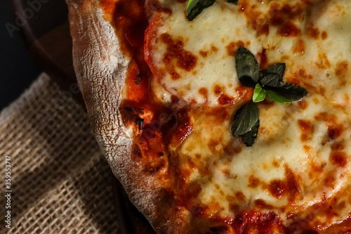 Piece of marguerita italian pizza with tomato