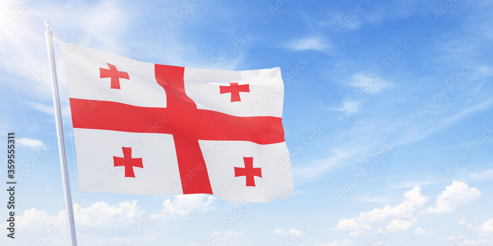 Georgian flag on a flagpole waving in blue cloudy sky. Georgia concept 3D rendering