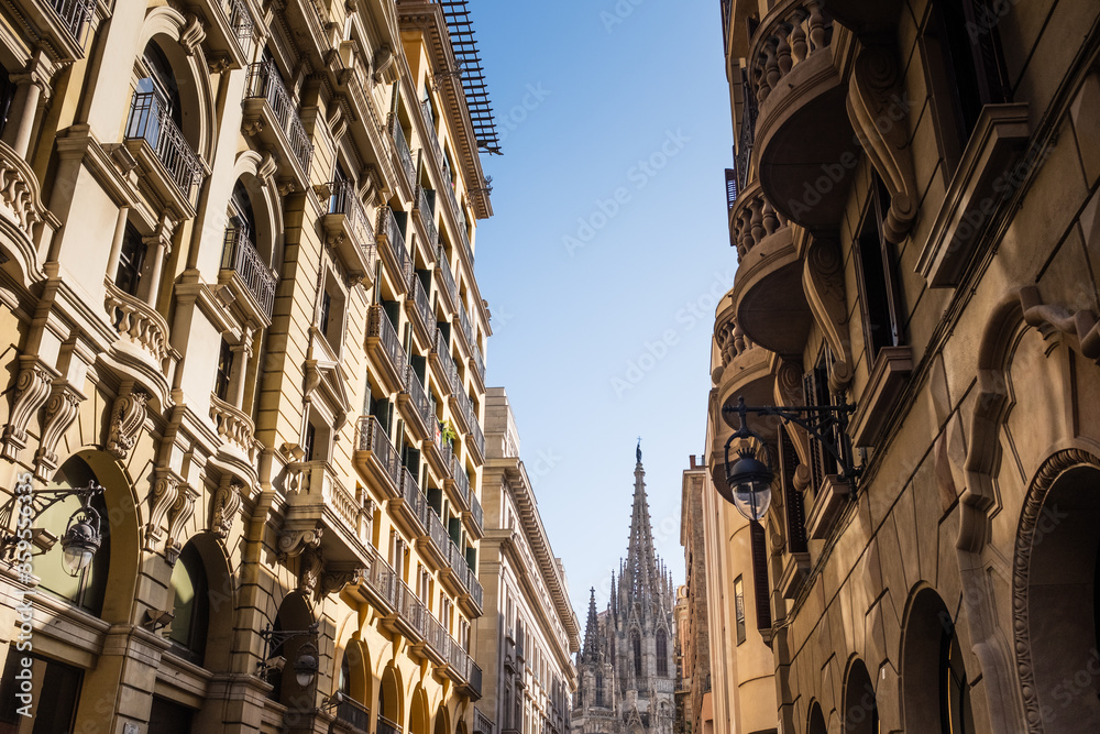 A partial view of the Cathedral of Holy Cross and Saint Eulalia (Catalonia, Spain) also know as Barcelona Cathedral seen from the street level looking up.