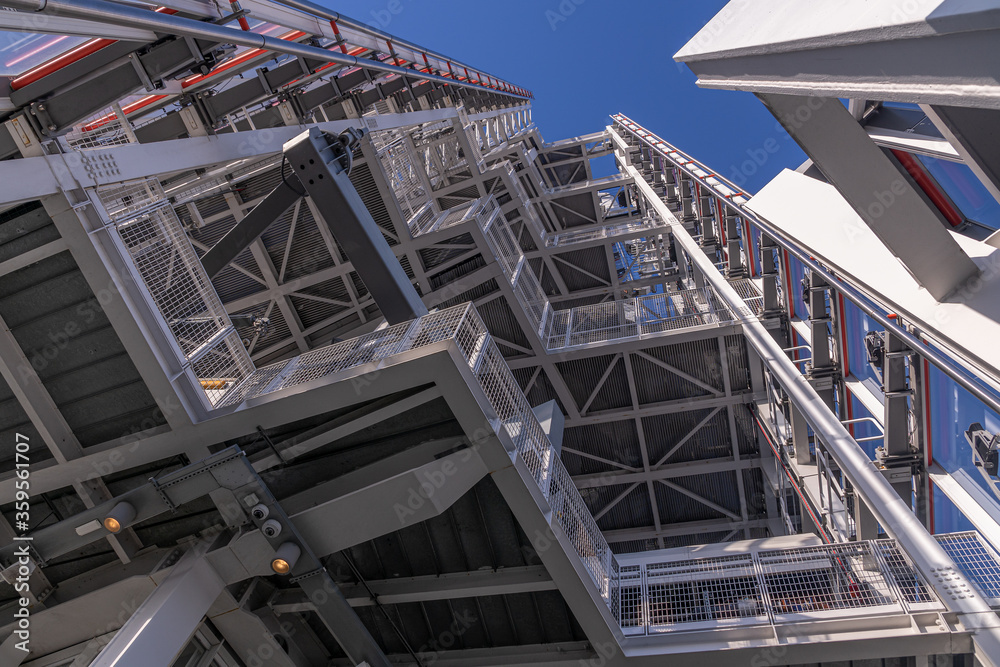 View through structural steel and glass work towards the blue sky on top of a skyscraper View through structural steel and glass work towards the blue sky on top of a skyscraper