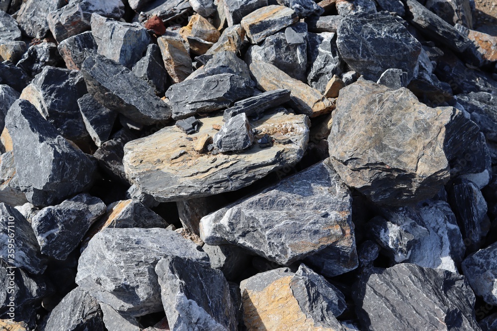 Big stone pile stacked for construction building in construction site closeup. Big stone pile stacked for construction building in construction site closeup.