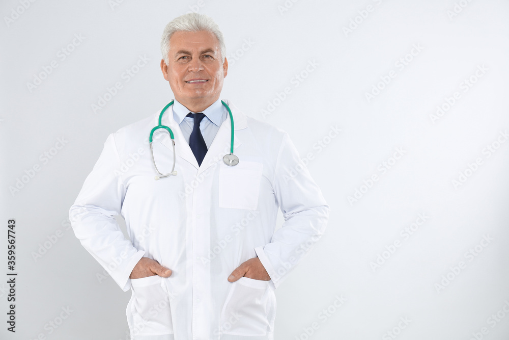 Portrait of senior doctor with stethoscope on white background Portrait of senior doctor with stethoscope on white background