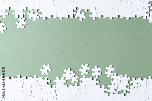 Fototapeta Naklejka Na Ścianę i Meble -  Blank white puzzle pieces on grey background, flat lay. Space for text