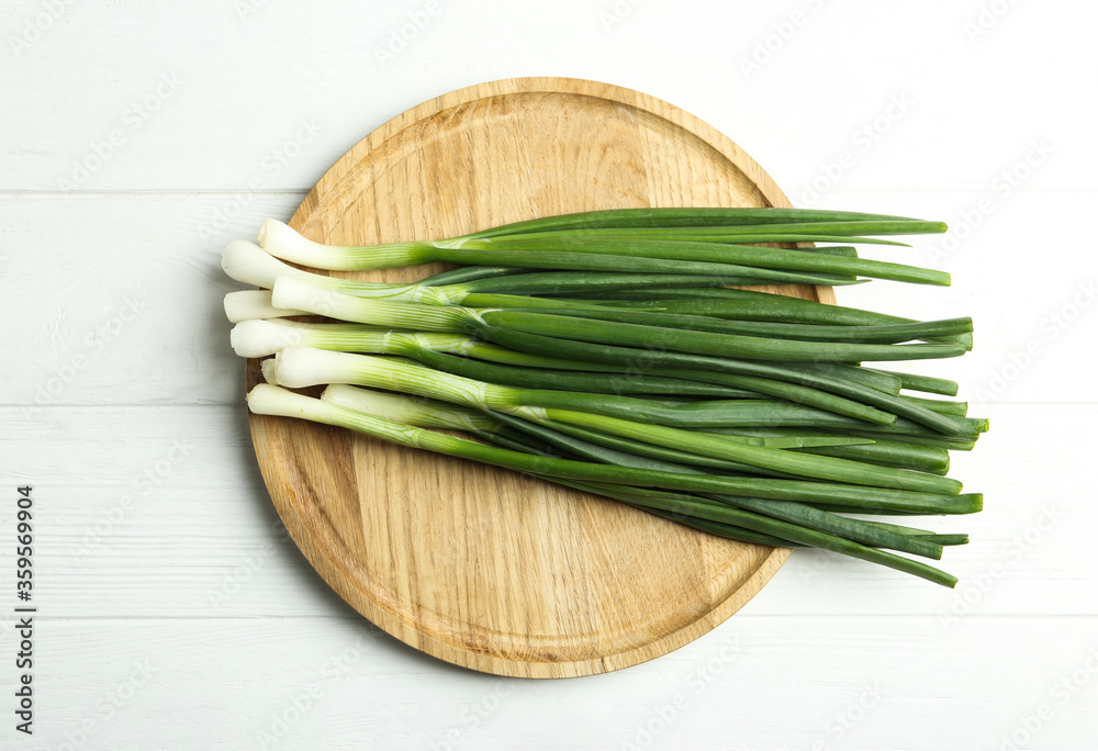 Fresh green spring onions on white wooden table, top view Fresh green spring onions on white wooden table, top view