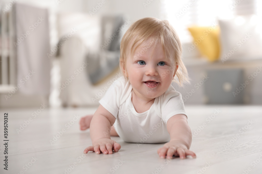Cute little baby on floor at home Cute little baby on floor at home