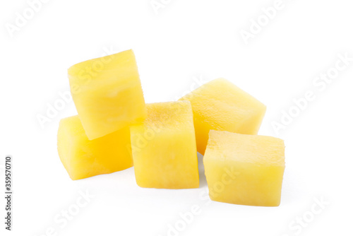 Tasty ripe mango cubes isolated on white