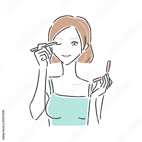 まぶたにアイシャドウを付けている女性のイラスト。