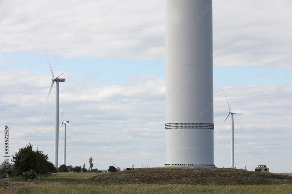 Beautiful view of field with wind turbines. Alternative energy source Beautiful view of field with wind turbines. Alternative energy source