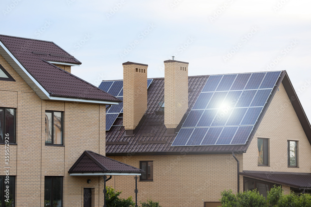 Fototapeta premium House with installed solar panels on roof