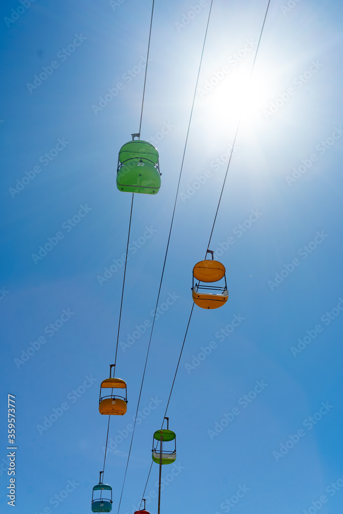 empty amusement park sky ride with no one and blue sky empty amusement park sky ride with no one and blue sky