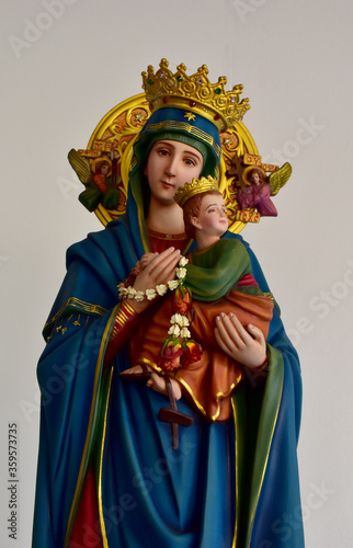 Closeup of Our lady of perpetual help statue virgin Mary with Child Jesus in the church, Thailand. selective focus.