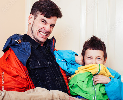 faher and son together having fun at home, lifestyle happy family, people at home photo