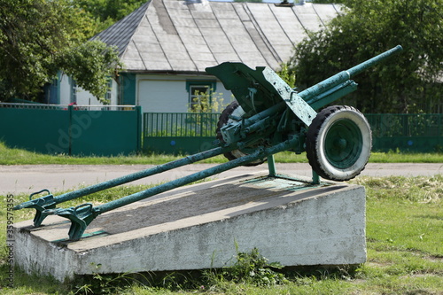 old soviet artillery gun on a pedestal photo