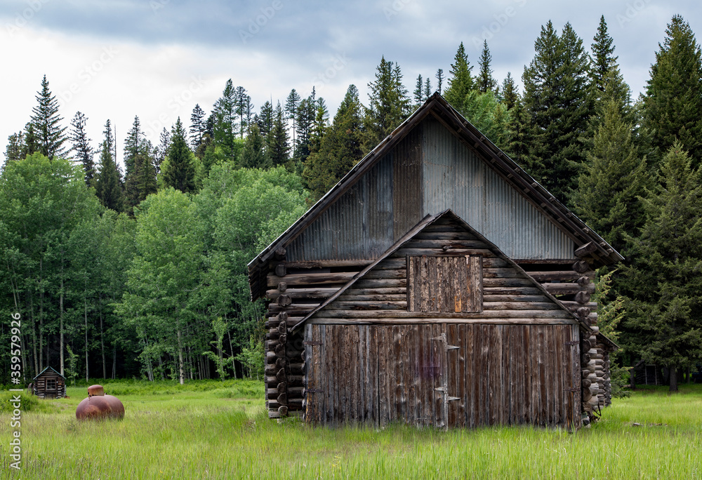 Log cabin by forest tree line in Montana Log cabin by forest tree line in Montana