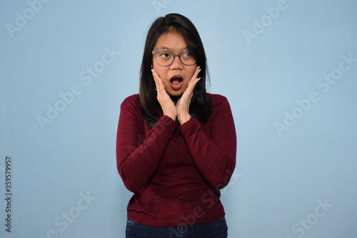 Portrait of Indonesian Woman Wearing Red Shirt And Posing With Isolated Background