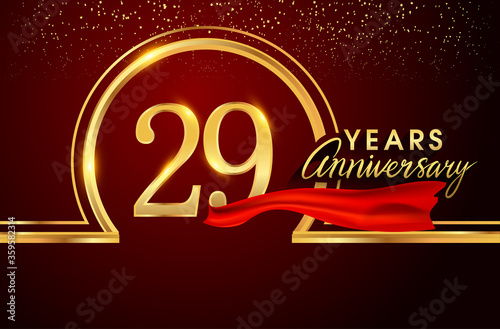 29th anniversary logo with confetti and golden ring, red ribbon isolated on red background, vector design for greeting card and invitation card.