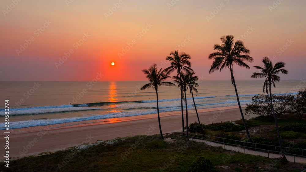 Ocean sunrise with palm tree's by the beach, Main beach Gold Coast.
