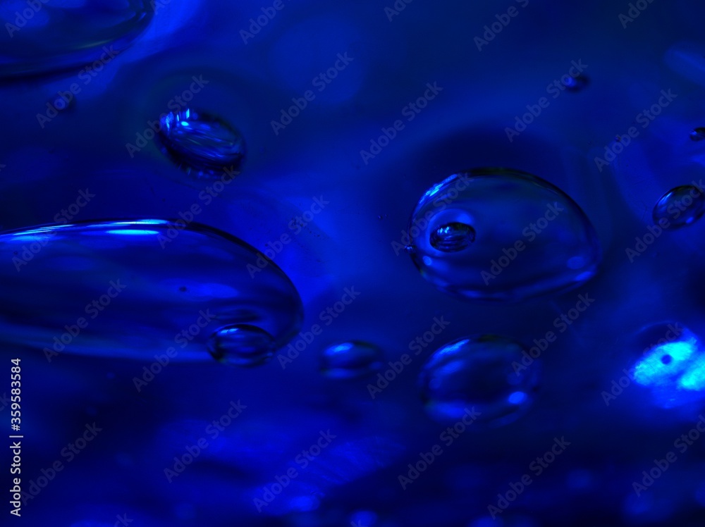 blurred blue water drops with shiny on glass , abstract background, dark and sweet color ,macro bubble for card design blurred blue water drops with shiny on glass , abstract background, dark and sweet color ,macro bubble for card design