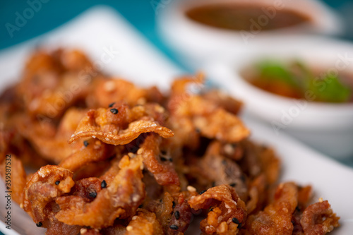 Crispy fried sliced belly pork with spicy sauce