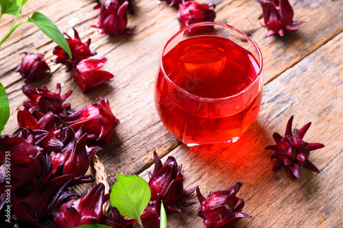 Roselle juice on wooden background, herbal organic tea for good healthy