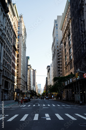 New York street pedestrian direction sign. Street name signs in Manhattan. Building sign. New York streets. Empty streets. New York buildings.  Old architecture buildings in Manhattan. Home facades. 