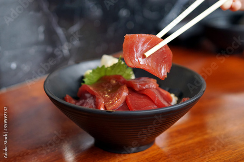 Akami Donburi - A rice bowl topped with tuna, served with wasabi, A japanese dish consisting of fish, meal, vegetable and served over rice.