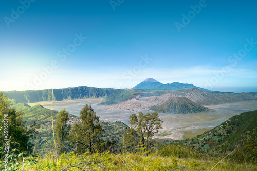 Mount Bromo is an active volcano  Indonesia. Panorama Bromo with blue sky background