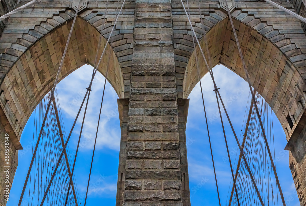 Fototapeta premium Closeup of the pointed arches above the passageways through the stone towers of the Brooklyn bridge in New York City USA