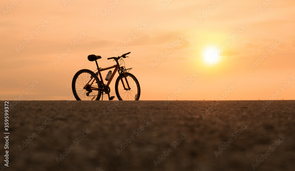 bicycle with sunset or sunrise background