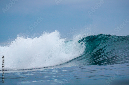 Fototapeta Naklejka Na Ścianę i Meble -  Aquamarine waves, on surf spot with empty line up in Indian Ocean