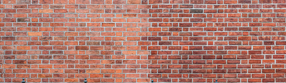 Panorama of large red brick wall with white grouting. Textured old vintage brick background. Panorama of large red brick wall with white grouting. Textured old vintage brick background.