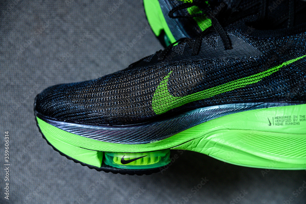 ROME, ITALY, JUNE 23. 2020: Nike running shoes ALPHAFLY NEXT%.  Controversial green, black athletics marathon shoe. Detail on Air Zoomx  foam, Air zoom puck, Nike Atomknit upper. For Tokyo Olympics 2020 Stock