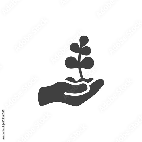 Hand with plant vector icon. filled flat sign for mobile concept and web design. Hand with sprout in soil glyph icon. Ecology symbol, logo illustration. Vector graphics © alekseyvanin