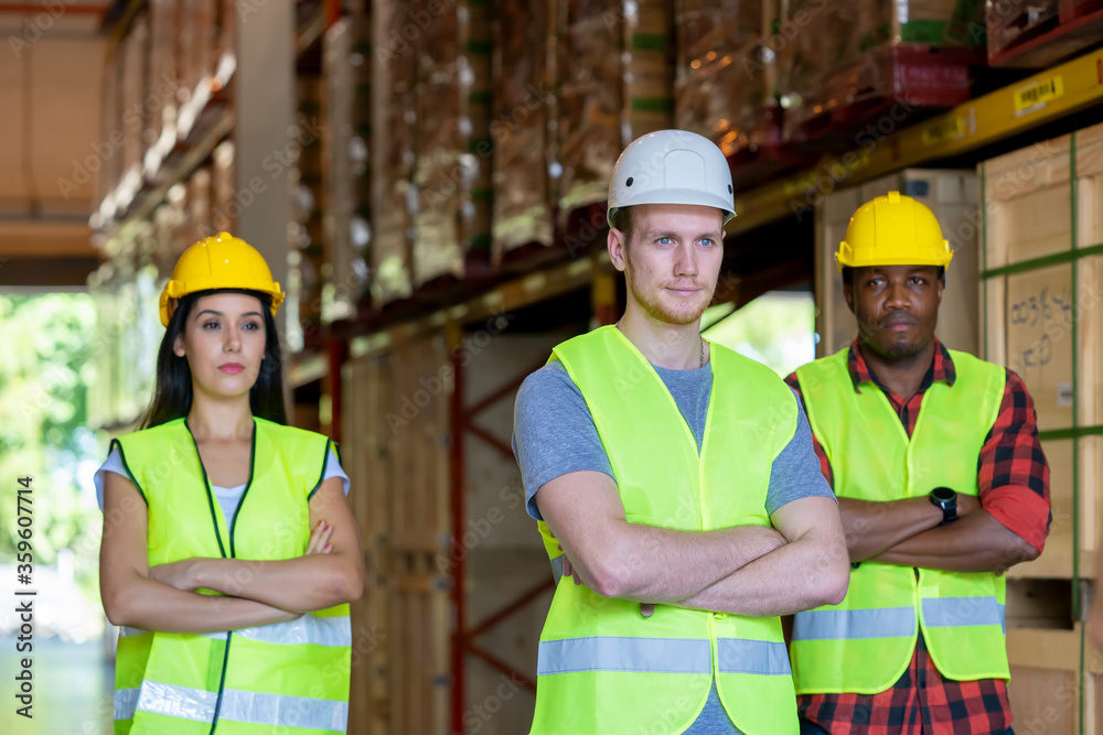 Warehouse manager and foreman working together in a large warehouse Warehouse manager and foreman working together in a large warehouse
