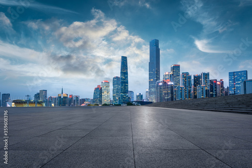 Empty square floor and modern city scenery at night in Shenzhen,China. © ABCDstock
