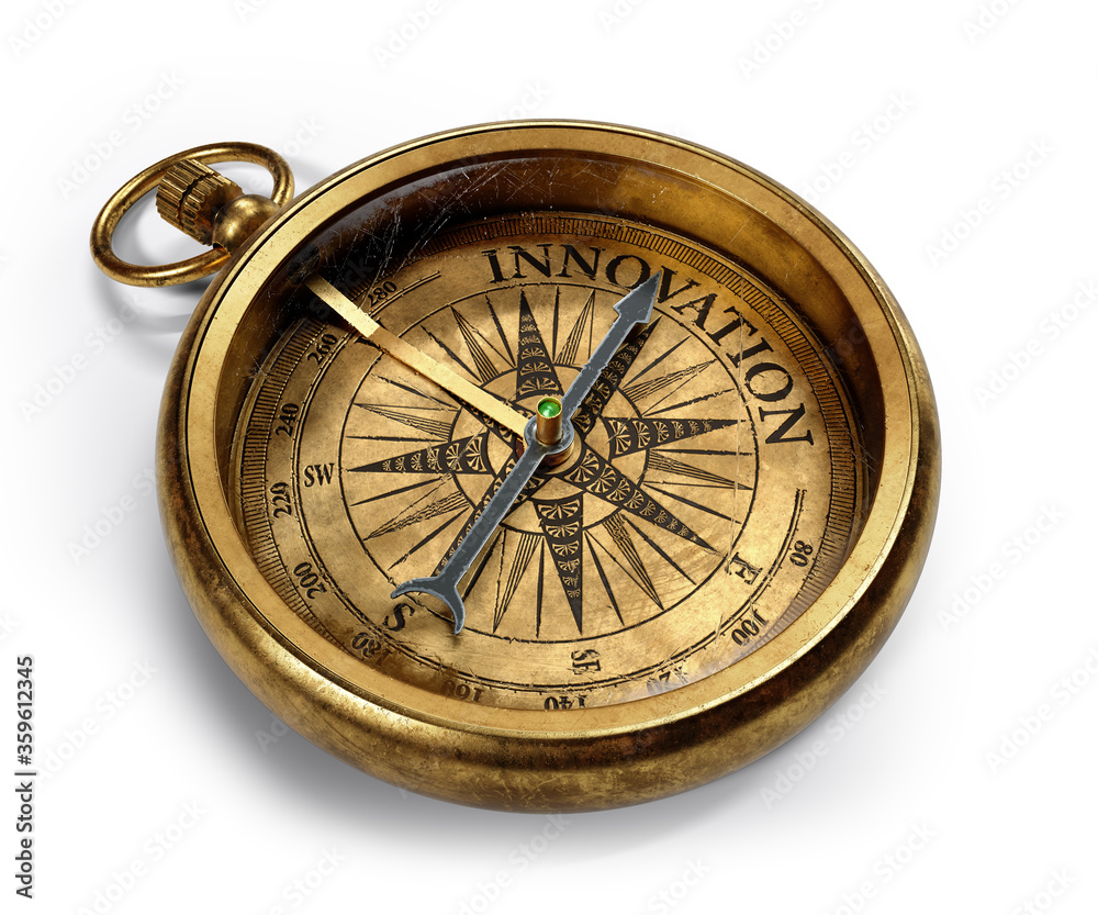 Vintage brass compass isolated on white background