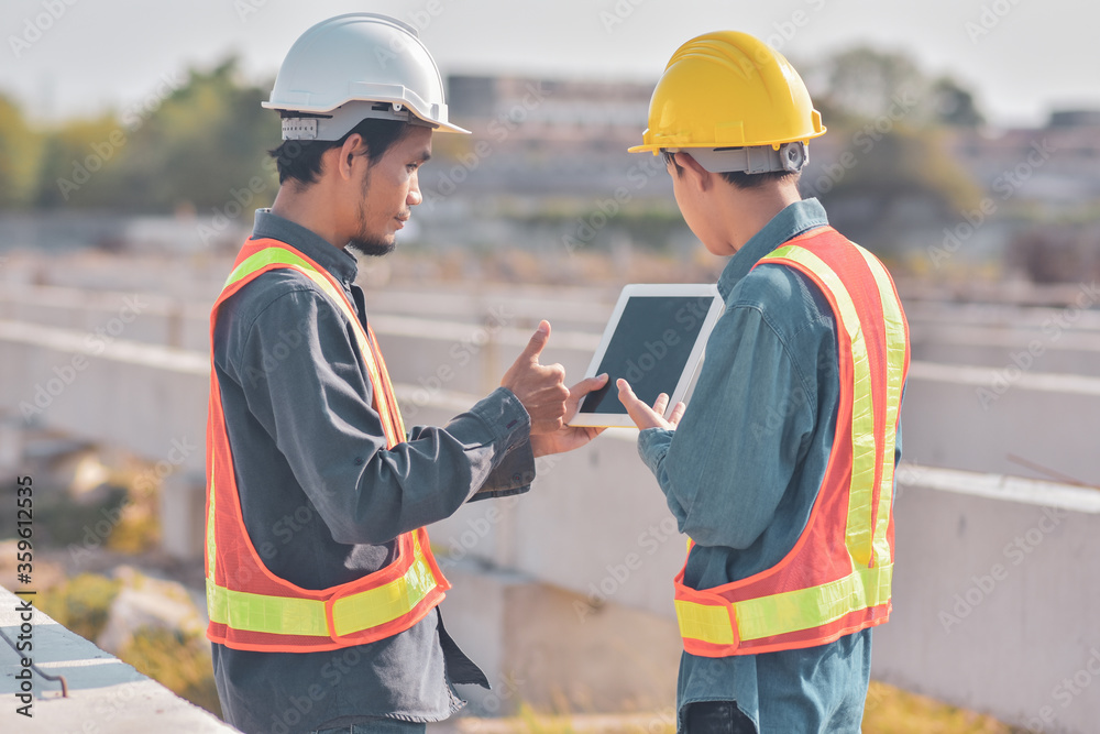 engineering team is currently discussing the planning of the construction project in the construction area. engineering team is currently discussing the planning of the construction project in the construction area.
