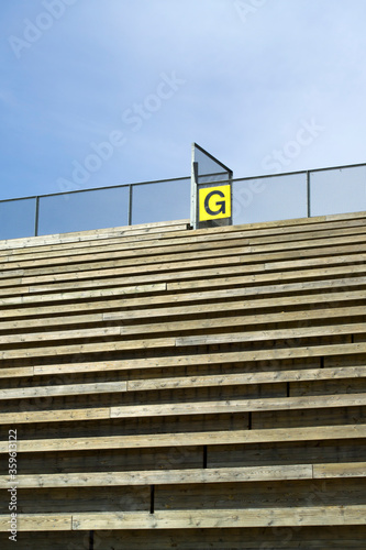 rows of empty stadium benches