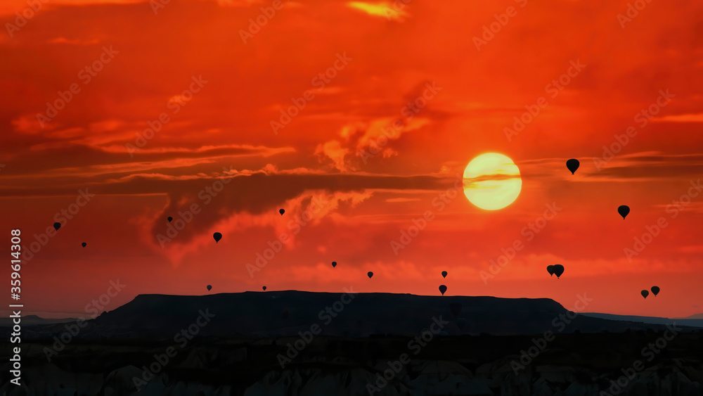 silhouettes of hot air balloons in Cappadocia, Turkey silhouettes of hot air balloons in Cappadocia, Turkey