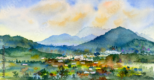 Watercolor landscape painting colorful of village, mountain and meadow.