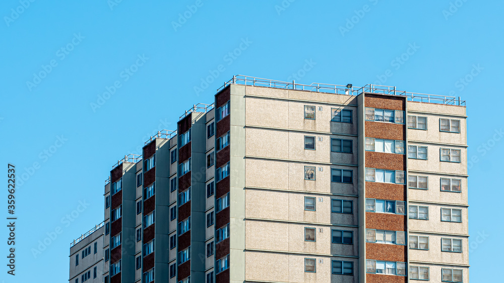 Fototapeta premium Close up of a housing commission, or public housing, building in Melbourne, Australia. The government built these apartments to provide low-income families with low rent housing.