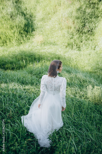 Wallpaper Mural beautiful woman in long white dress posing in the field  Torontodigital.ca