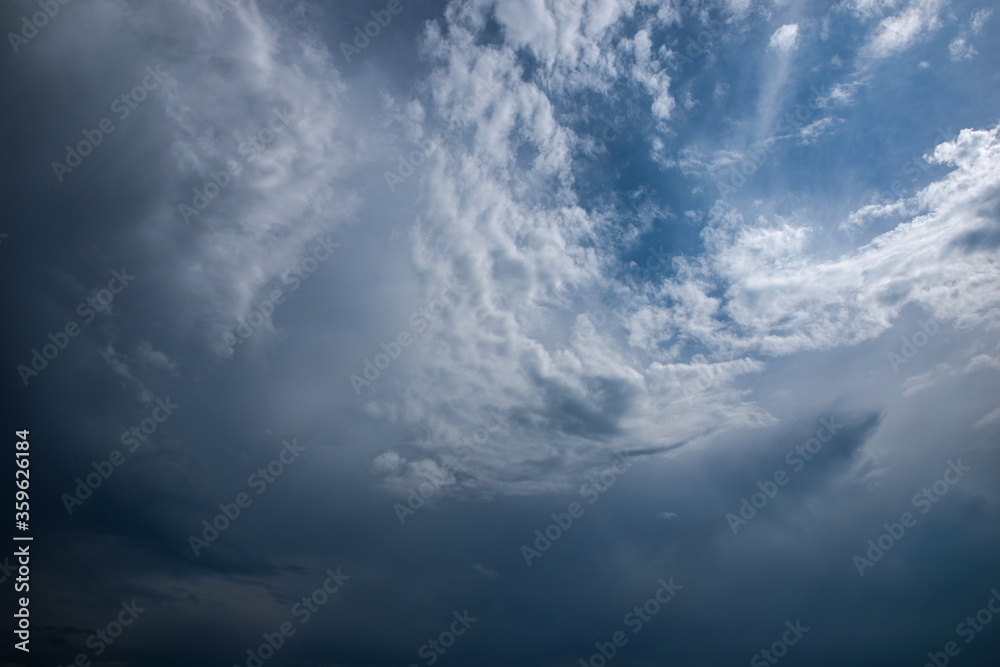 Obraz premium Dark thunderclouds on a blue sky.