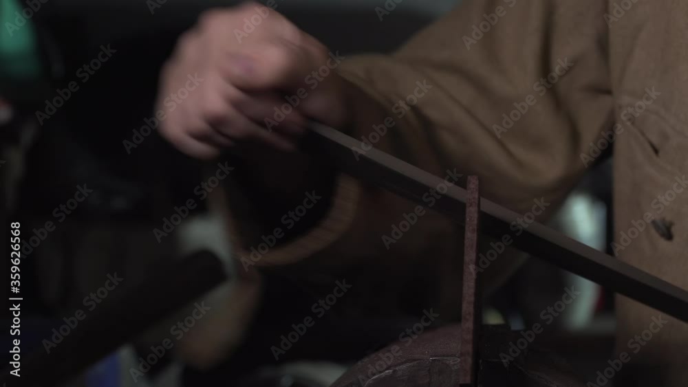 The iron part is processed by the file. Close-up 4K The iron part is processed by the file. Close-up 4K