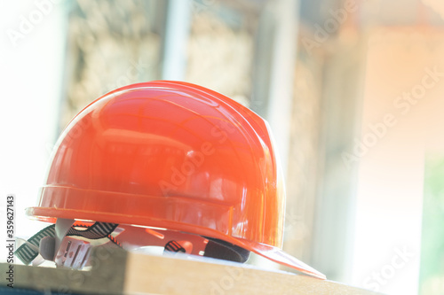 Orange safety helmet hat for safety workman as engineer or worker.