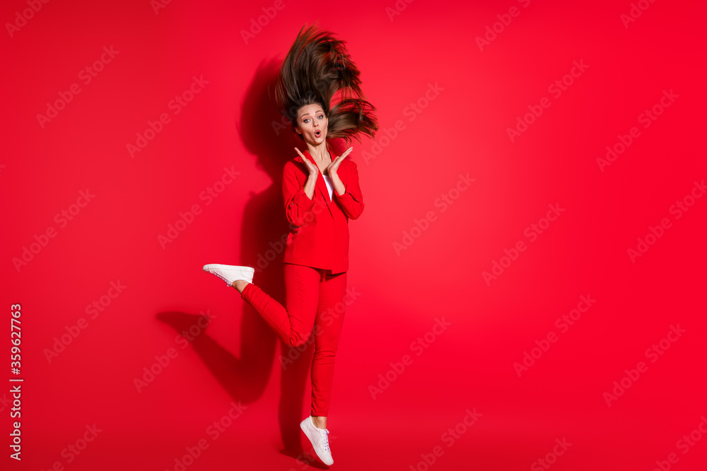 Full length photo of attractive worker lady having fun jumping high up good mood overjoyed amazing news wear blazer suit trousers footwear isolated bright vivid red color background Full length photo of attractive worker lady having fun jumping high up good mood overjoyed amazing news wear blazer suit trousers footwear isolated bright vivid red color background